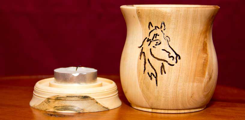 Pierced horse candle holder